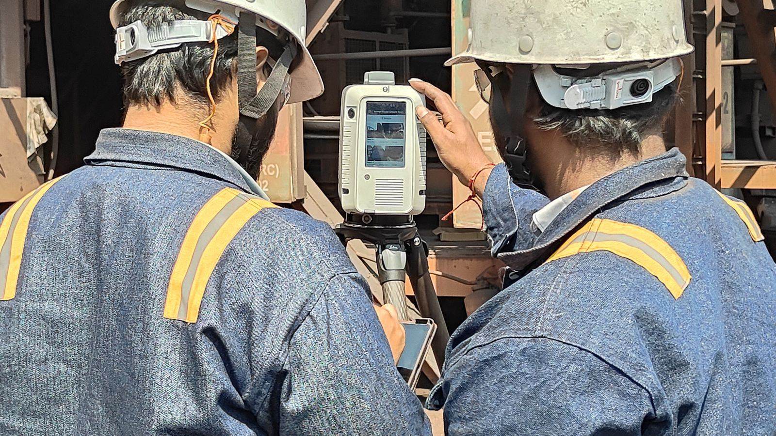 VB engineers operating a Leica RTC360 laser scanner on a plant walkway