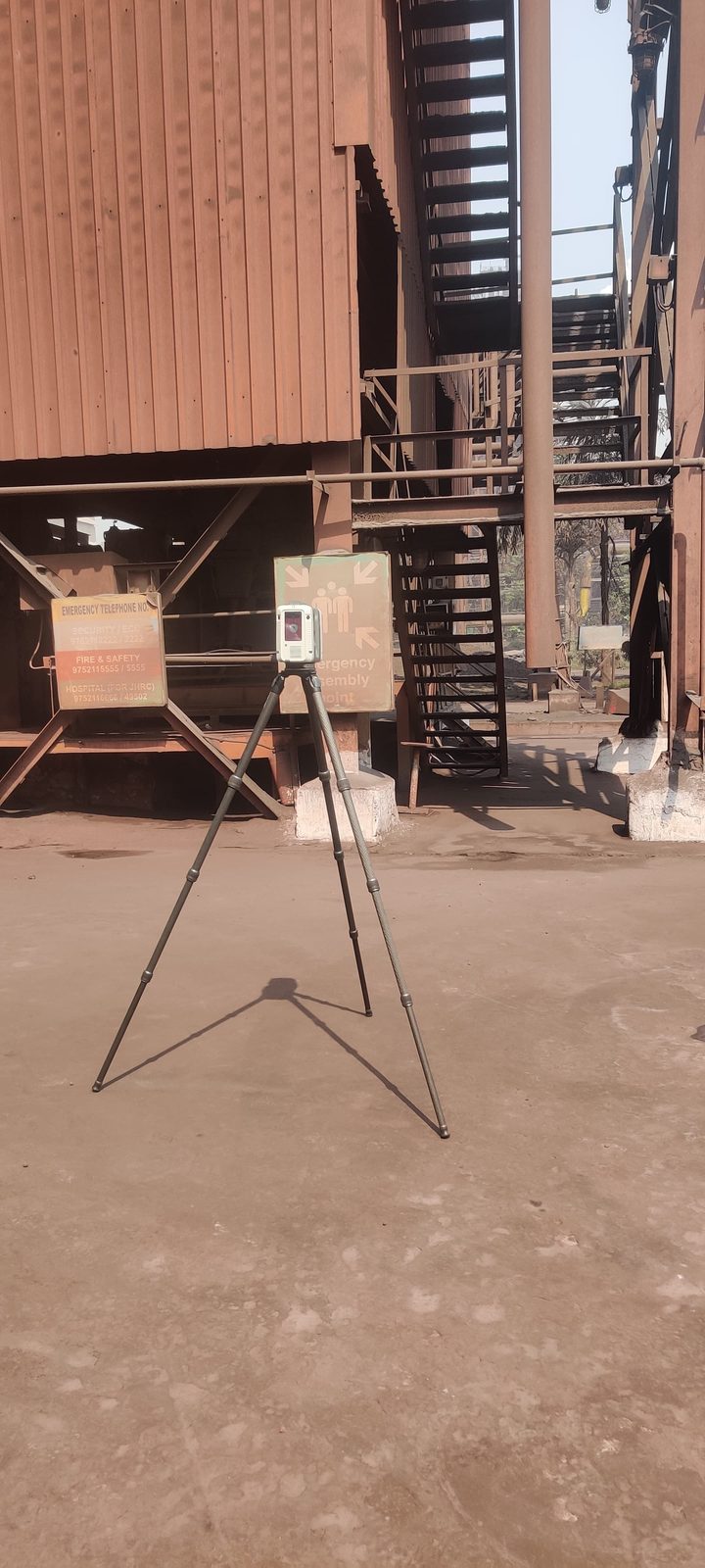 Leica tripod laser scanner set up on an operating plant floor during a VB LiDAR scan, the first step in building a plant's digital twin